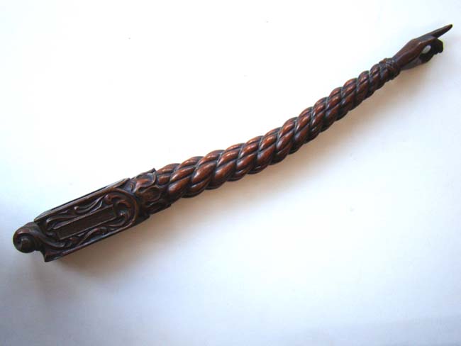 A fine 19th century carved tiller handle with pointed finger terminus